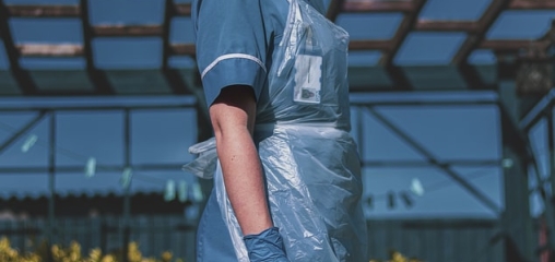 What is the effectiveness of protective gowns and aprons against COVID-19 in primary care settings?