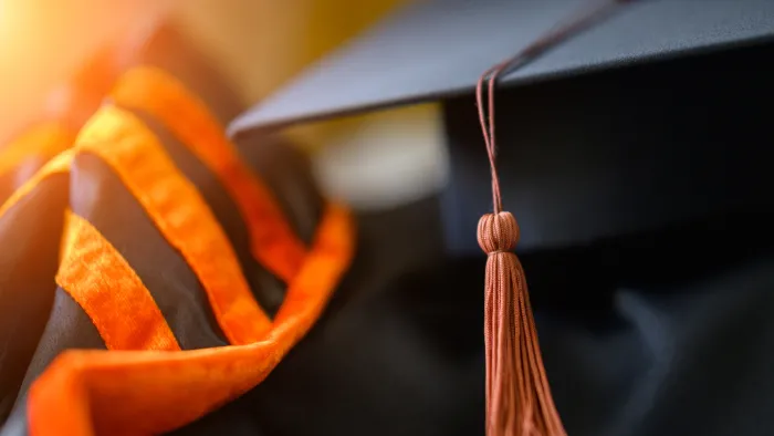 PhD graduate in gown