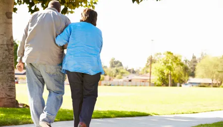 Family carer walking in the park