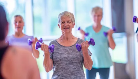 Older people lifting weights