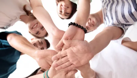 People putting hands together